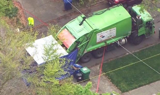 Area garbage trucks were called to the scene to be searched for additional remains. (KIRO 7)