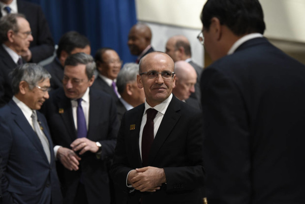 Turkish Deputy Prime Minister Mehmet Simsek arrives for the G-20 Finance Minister and Central Bank Governors group photo, during the World Bank/IMF Spring Meetings at IMF headquarters in Washington, Friday, April 15, 2016. (AP Photo/Sait Serkan Gurbuz)