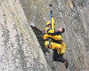 In this photo provided by Bob Isenberg, Michael Banks is rescued after being stranded on a ledge some 80 off the ground on Morro Rock, a landmark in Morro Bay, Calif., Thursday, April 7, 2016. He had scaled the rock to make an Internet proposal to his girlfriend - who said yes - but then got stuck on a ledge and couldn't get down. A helicopter had to be called, and Morro Bay Fire Department Capt. Todd Gailey was lowered by cable to pluck Banks and take him to safety.(Bob Isenberg via AP)