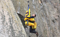 In this photo provided by Bob Isenberg, Michael Banks is rescued after being stranded on a ledge some 80 off the ground on Morro Rock, a landmark in Morro Bay, Calif., Thursday, April 7, 2016. He had scaled the rock to make an Internet proposal to his girlfriend - who said yes - but then got stuck on a ledge and couldn't get down. A helicopter had to be called, and Morro Bay Fire Department Capt. Todd Gailey was lowered by cable to pluck Banks and take him to safety.(Bob Isenberg via AP)