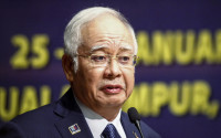 FILE - In this Monday, Jan. 25, 2016 file photo, Malaysian Prime Minister Najib Razak delivers his opening speech at a conference in Kuala Lumpur, Malaysia. Saudi Arabia has for the first time publicly confirmed Malaysia's claim that $681 million in Prime Minister Najib Razak's bank accounts was a donation from the Saudi royal family, countering accusations that the money was siphoned from heavily indebted state investment fund 1MDB. Saudi Arabian Foreign Minister Adel Al-Jubeir called the money a "genuine donation" in comments Thursday, April 14, 2016, to Malaysian reporters in Istanbul after a meeting with Najib. (AP Photo/Joshua Paul, File)