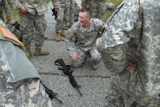In this April 12, 2016 photo, ROTC cadet Jacob Jasewicz squats next to an unloaded rifle that was used as part of a training exercise at Norwich University in Northfield, Vt., The exercise is part of the training undergone by ROTC students at Norwich. On April 21 and 22, some of the nations top military officers will be at Norwich to commemorate the 100th anniversary of ROTC, which produces about 70 percent of the nations military officers. (AP Photo/Wilson Ring)