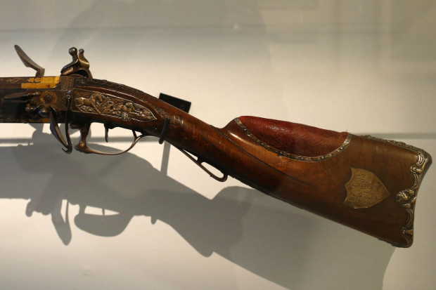 Napoleon's 1815 hunting rifle is displayed during a press visit of the exhibition "Napoleon in St Helena" in Paris, France, Tuesday, April 5, 2016. France's national army museum "Les Invalides" has recreated the home where Napoleon lived his final years, bringing furniture and belongings from the remote Atlantic Island of St. Helena to central Paris for the first time since he was exiled there 200 years ago. (AP Photo/Francois Mori)