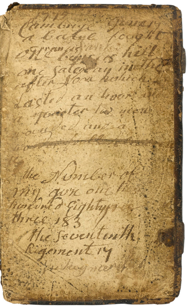 This photo provided Bonhams shows an inscribed pocket Bible carried by a Massachusetts soldier during the Battle of Bunker Hill on June 17, 1775 that will be auctioned next week in New York.  A  rare newspaper printing of a journal kept by a young George Washington and the bible are among hundreds of historic documents being sold at a New York City auction.  (Courtesy of Bonhams via AP)