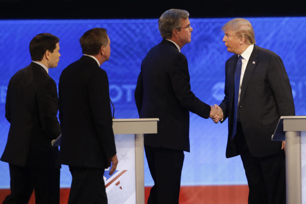 FILE - In this Feb. 6, 2016 file photo, Republican presidential candidate Donald Trump shakes hands with then-fellow presidential candidate, former Florida Gov. Jeb Bush as Republican presidential candidate, Sen. Marco Rubio, R-Fla., and Republican presidential candidate, Ohio Gov. John Kasich , in Manchester, N.H.  But rarely have so many partnerships of political necessity appeared to be as reluctant, awkward, even downright tortured as in the 2016 GOP race. (AP Photo/David Goldman, File)