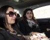 Public relations expert Francesca Chaouqui, right, is accompanied by her lawyer Laura Sgro' as she arrives at the Vatican for her trial, Monday, April 11, 2016. Two Italian journalists who wrote books detailing Vatican mismanagement face trial in a Vatican courtroom along with three people accused of leaking them the information in a case that has drawn scorn from media watchdogs. (Massimo Percossi/ANSA via AP)