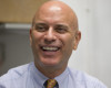 In this photo taken April 6, 2016, Tim Canova smiles as he speaks during an interview at his campaign headquarters in Hollywood, Fla. When Canova, a law school professor and political activist, pressed his south Florida congresswoman to vote against fast-track trade legislation last summer, he said he got the brush off from her staff. Angered over the experience and what he viewed as a lawmaker with a less than progressive voting record, the constituent turned the political tables on one of the Democratic Party’s most powerful leaders, Rep. Debbie Wasserman Schultz. He decided to run against her.  (AP Photo/Wilfredo Lee)