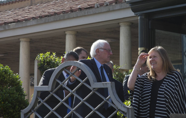 US presidential candidate Bernie Sanders flanked by his wife Jane O'Meara, right, arrive at a hotel near the Vatican Saturday, April 16, 2016. Democratic presidential candidate Bernie Sanders says in an interview with The Associated Press that he met with Pope Francis. Sanders says the meeting took place Saturday morning before the pope left for his one-day visit to Greece. He says he was honored by the meeting, and that he told the pope he appreciated the message that he is sending the world about the need to inject morality and justice into the world economy. (AP Photo/Alessandra Tarantino)