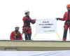 Greenpeace activists hold a banner as they stand on the roof of Poland's Environment Ministry building in Warsaw, Poland, Tuesday, April 12, 2016. The protest comes in reaction to government plans for widespread logging in the Bialowieza forest, Europe's last primeval forest. (AP Photo/Alik Keplicz)