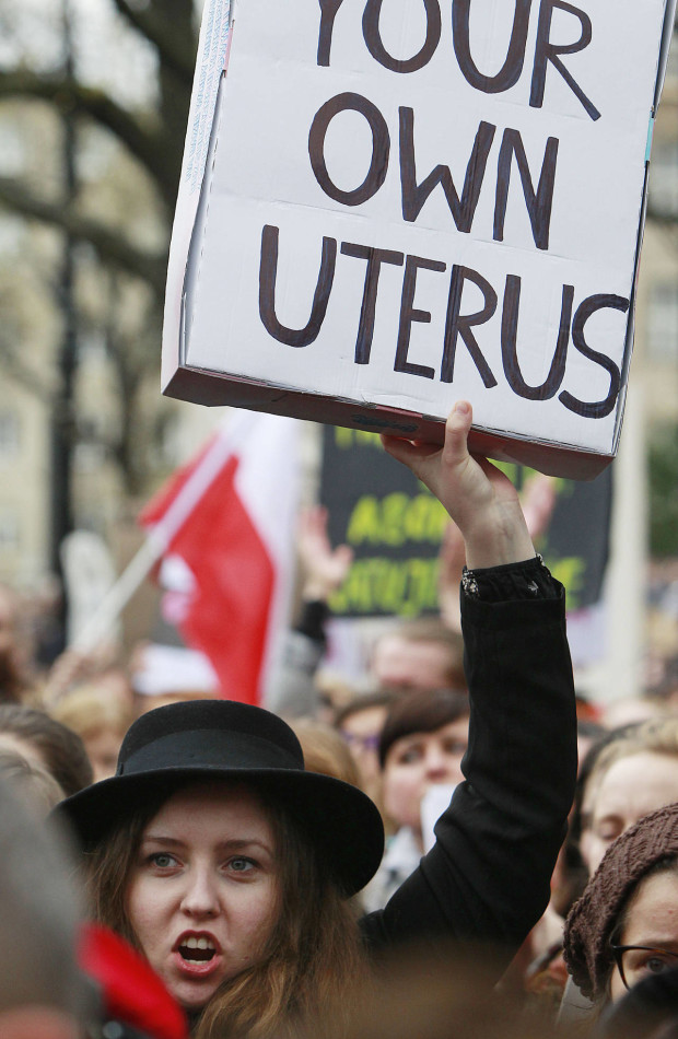 A woman holding a banner takes part in a street protest against the further tightening of Poland’s already strict anti-abortion law in Warsaw, Poland, on Saturday, April 9, 2016. Similar protests were also organized in other cities by a new pro-abortion group that opposes steps by some of Poland’s Catholic bishops and an anti-abortion organization to introduce an unconditional ban on abortion in Poland. (AP Photo/Czarek Sokolowski)