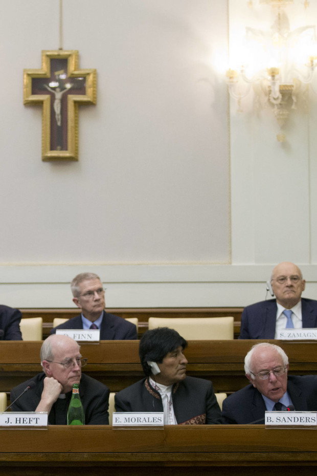 US presidential candidate Bernie Sanders speaks at a conference commemorating the 25th anniversary of "Centesimus Annus," a high-level teaching document by Pope John Paul II on the economy and social justice at the end of the Cold War, at the Vatican, Friday, April 15, 2016. (AP Photo/Andrew Medichini)