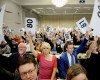 Norwegian Church Council leader Kristin Gunleiksrud Raaum, centre, in red, and Chairman of the Oslo diocesan council Gard Sandaker-Nielsen, centre, right,  vote to allow homosexuals to be married within the Norwegian Church. The Church of Norway voted on Monday April 11, 2016 in Trondheim, Norway to approve new marriage ceremony rules that will allow homosexuals to be married within the church. (Ole Martin Wold / NTB scanpix via AP)   NORWAY OUT