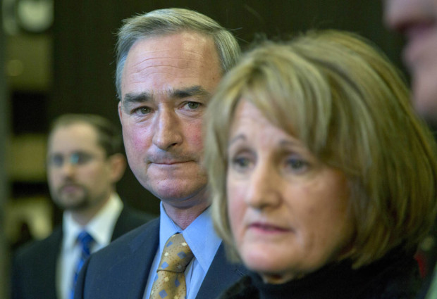 FILE - In this Nov. 23, 2015 file photo, Robert Gifford looks on as his wife Cynthia speaks to reporters in Albany, N.Y. The Giffords, owners of Liberty Ridge Farm north of Albany, refused to host the 2013 wedding of Melisa and Jennie McCarthy, citing their belief that marriage is between a man and a woman. Republican lawmakers have advanced measures in about a dozen states this year that could strengthen protections for those who refuse for religious reasons to provide services to gay couples. (AP Photo/Mike Groll, File)