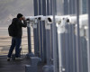 A man uses binoculars to watch the North side at the Imjingak Pavilion near the border with North Korea, in Paju, in Seoul, South Korea, Friday, April 15, 2016. A North Korean launch of a missile on the birthday of its revered founder appears to have failed, South Korean and U.S. defense officials said Friday. (AP Photo/Lee Jin-man)