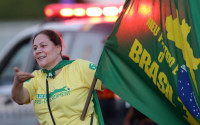 A demonstrator takes part in demonstration in support of the impeachment of Brazil's President Dilma Rousseff, in front of the Supreme Court, in Brasilia, Brazil, Thursday, April 14, 2016. Brazil's top court said it would soon rule on President Rousseff's motion to annul the upcoming impeachment vote against her, a process that the top legal official in her government said had been "contaminated." (AP Photo/Eraldo Peres)