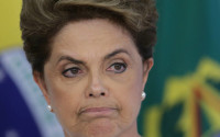 Brazil's President Dilma Rousseff attends a meeting on state land issues, at Planalto presidential palace in Brasilia, Brazil, Friday, April 15, 2016. The lower chamber of Brazil's Congress began a debate on whether to impeach Rousseff, a question that underscores deep polarization in Latin America's largest country and most powerful economy. The crucial vote is slated for Sunday. (AP Photo/Eraldo Peres)