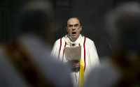 FILE - In this April 3, 2016 photo, French Cardinal Philippe Barbarin, Archbishop of Lyon, leads a mass for migrants, in Lyon, central France. The French Catholic Church announced Tuesday, April 12, 2016 the creation a new independent commission made up of secular experts to advice bishops and help them handling the sensitive cases of child sex abuses by priests, amid growing concerns over newly-revealed pedophilia cases, especially in the Lyon diocese run by cardinal Barbarin. (AP Photo/Laurent Cipriani, File)