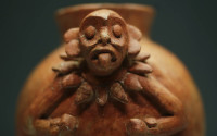 A pot with a monkey, 900-1250 AD, is displayed at the exhibition 'The Maya – Language of Beauty at the Martin-Gropius-Bau' museum in Berlin, Monday, April 11, 2016. The exhibition will run from April 12. until August 7, 2016. (AP Photo/Markus Schreiber)