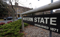 FILE - This Nov. 18, 2015, file photo shows a sign near the main entrance of Western State Hospital, the largest psychiatric hospital in the state, in Lakewood, Wash. Washington Gov. Jay Inslee on Tuesday, April 12, 2016, fired the head of a the state psychiatric hospital after an accused murderer escaped from the hospital last week. (AP Photo/Ted S. Warren, File)