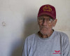 In this April 5, 2016 photo, Pedro Alejandro Lopez, 83, poses for a portrait inside his home on Calle Habana in Old Havana, Cuba. Lopez and his wife moved in their 1918 four-bedroom colonial home on Calle Habana forty years ago. A truck driver from the national electric company, the state let him purchase the home in exchange for monthly payments of 50 pesos over the course of 20 years, the equivalent of about $2 a month, not adjusted for inflation. (AP Photo/Desmond Boylan)