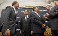 Tennessee Gov. Bill Haslam, left, talks with S. H. John Sun, vice chairman and CEO of Hankook Tire Wednesday, April 13, 2016, in Nashville, Tenn., after it was announced that Hankook is relocating its North American headquarters from New Jersey to Tennessee. Ralph Schulz, right, president of the Nashville Chamber of Commerce, talks with Hee Se Ahn, president of Hankook Tire America Corp. (AP Photo/Mark Humphrey)