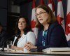 Canada's Health Minister Jane Philpott, right, speaks as Justice Minister Jody Wilson-Raybould listens at a news conference in Ottawa on Thursday, April 14, 2016. Canada has introduced a new assisted suicide law that will only apply to Canadians and residents, meaning Americans won't be able to travel to Canada to die. Visitors will be excluded under the proposed law announced Thursday, precluding the prospect of suicide tourism. Canadian government officials said to take advantage of the law the person would have to be eligible for health services in Canada.  (Adrian Wyld /The Canadian Press via AP) MANDATORY CREDIT