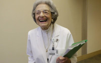 Patient relations representative Elena Griffing smiles while interviewed at Sutter Health Alta Bates Summit Medical Center in Berkeley, Calif., Monday, April 11, 2016. Griffing, 90, has started her 70th year working for the same San Francisco Bay Area hospital. (AP Photo/Jeff Chiu)