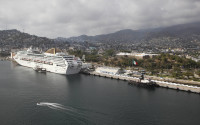 FILE - In this Jan. 16, 2011 file photo, a cruise ship is docked at the port in Acapulco, Mexico. The U.S. government on Friday, April 15, 2016 barred its employees from traveling to the Mexican resort city of Acapulco, where a rise in homicides attributed to drug gangs has made it one of the world’s deadliest cities in recent years. (AP Photo/Alexandre Meneghini, File)