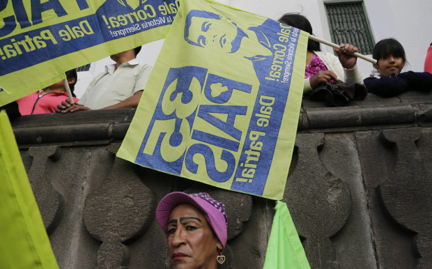 In this Thursday, April 7, 2016 photo, pro-government supporters attend rally in support of President Rafael Correa in Quito, Ecuador. The government and opposition called for demonstrations, for and against, the financial measures proposed by the government to deal with the economic downturn caused by the slump in oil prices. (AP Photo/Dolores Ochoa)