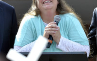 FILE - In this file photo dated Tuesday, Sept. 8, 2015, Rowan County Clerk Kim Davis pauses as she speaks after being released from a detention centre, Tuesday, Sept. 8, 2015, in Grayson, Ky. USA.  On Tuesday April 12, 2016, Pope Francis named French Monsignor Christophe Pierre as Ambassador to United States, replacing Archbishop Carlo Maria Vigano, who was behind Francis' controversial meeting with Kim Davis, the Kentucky clerk who went to jail rather than comply with a court order to issue same-sex marriage licenses.  (AP Photo/Timothy D. Easley, FILE)