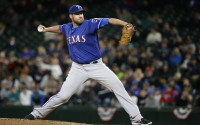 Texas Rangers starting pitcher Colby Lewis throws against the Seattle Mariners in the sixth inning of a baseball game, Monday, April 11, 2016, in Seattle. (AP Photo/Ted S. Warren)