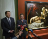 Auction officer Marc Labarbe, left, and Eric Turquin expert specialized in old master paintings talk to the media in Paris, Tuesday, April 12, 2016. A 400-year-old painting that might have been executed by Italian master Caravaggio and could be worth more than 100 million euros has been found in an attic in Southern France.The picture, whose authenticity has not been established, had been left for more than 150 years in a property in the outskirts of Toulouse. (AP Photo/Michel Euler)