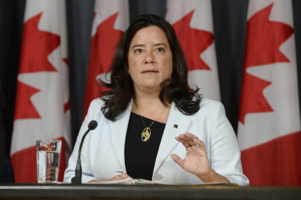Canada's Justice Minister Jody Wilson-Raybould speaks at a news conference in Ottawa on Thursday, April 14, 2016. Canada has introduced a new assisted suicide law that will only apply to Canadians and residents, meaning Americans won't be able to travel to Canada to die. Visitors will be excluded under the proposed law announced Thursday, precluding the prospect of suicide tourism. Canadian government officials said to take advantage of the law the person would have to be eligible for health services in Canada.  (Adrian Wyld /The Canadian Press via AP) MANDATORY CREDIT