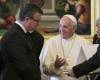 Pope Francis speaks with Croatian Prime Minister Tihomir Oreskovic, left, and his wife Sanja Dujmovic, right, on the occasion of their private audience, at the Vatican, Thursday, April 7, 2016. (Alessandro Di Meo/Pool Photo via AP)