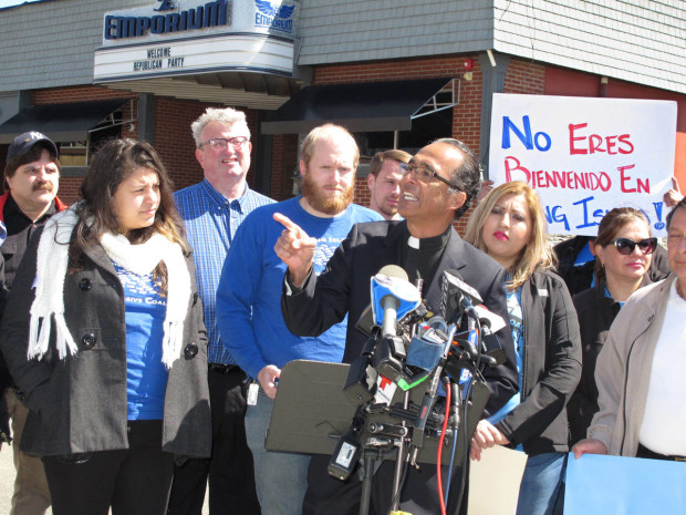 The Rev. Alan Ramirez, an adviser to the family of Marcelo Lucero, speaks at a press conference in Patchogue, N.Y., on Wednesday, April, 13, 2016. Ramirez is calling for Donald Trump to cancel a planned appearance at a Suffolk County Republican Committee fundraiser on Thursday, April 14, in Patchogue, because it is being held at a nightclub just blocks from where a gang of teenagers killed Lucero in November 2008. (AP Photo/Frank Eltman)