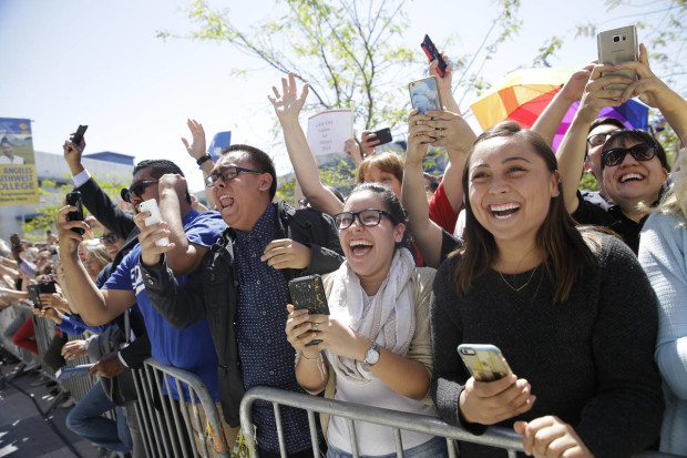 Supporters in the overflow area cheer as they watch Democratic presidential candidate Hillary Clinton walk toward them during a campaign event at the Los Angeles Southwest College on Saturday, April 16, 2016, in Los Angeles. (AP Photo/Jae C. Hong)
