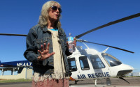 Ann Rodgers recalls being lost in the eastern Arizona mountains for nine days before being rescued, while at the Arizona Department of Public Safety hangar in Tucson International Airport, Wednesday, April 13, 2016. Rodgers, of Tucson, Ariz., was headed to Phoenix and got lost near the White Mountains east of the Phoenix area. Her hybrid car ran out of gas and electric power, leaving her stranded in the middle of nowhere. Rodgers was rescued on April 9. (AP Photo/Astrid Galvan)