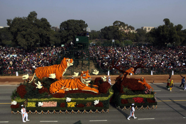 FILE - In this Wednesday, Jan. 26, 2011, file photo, a floral tableau by Central Public Works Department depicts the theme "Save Tigers" during the Republic Day parade in New Delhi, India. Countries with wild tiger populations have agreed to do more to protect tiger habitats that are shrinking drastically because of deforestation and urban sprawl, conservationists said Friday, April 15, 2016. Representatives from the 13 Asian countries with tigers, meeting this week in New Delhi, issued a resolution acknowledging that the forests in which tigers live are inherently valuable themselves and worthy of protection.(AP Photo/Manish Swarup, File)