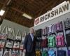 Founder and CEO Mark Dwight poses by a wall of backpacks and totes at his Rickshaw Bagworks factory store on Monday, April 4, 2016, in San Francisco. The San Francisco Board of Supervisors is voting on whether to require six weeks of fully paid leave for new parents - a move that would be a first for any jurisdiction. For small businesses, however, the proposal is yet another requirement that cuts into their competitive edge. Dwight, whose company of 30 employees makes custom work bags in San Francisco, said local businesses don’t have the wiggle room to spread costs or turn to deep-pocketed investors. (AP Photo/Eric Risberg)