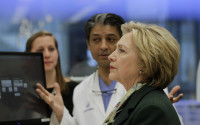 Democratic presidential candidate Hillary Clinton tours a lab at the Jacobs Institute. Friday, April 8, 2016, in Buffalo, N.Y. (AP Photo/Mike Groll)