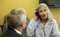 Former Charles Manson follower Leslie Van Houten confers with her attorney Rich Pfeiffer during a break from her hearing before the California Board of Parole Hearings at the California Institution for Women in Chino, Calif., Thursday, April 14, 2016. The panel recommended parole for Van Houten more than four decades after she went to prison for the killings of a wealthy grocer and his wife. The decision will now undergo administrative review by the board. If upheld it goes to Gov. Jerry Brown, who has final say on whether the now-66-year-old Van Houten is released. (AP Photo/Nick Ut)