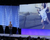 Facebook CEO Mark Zuckerberg delivers the keynote address with a video image of his wife, Priscilla Chan, and daughter, Max, behind him at the F8 Facebook Developer Conference Tuesday, April 12, 2016, in San Francisco.  Zuckerberg said Facebook is releasing new tools that businesses can use to build "chatbots," or programs that can talk to customers in conversational language. (AP Photo/Eric Risberg)
