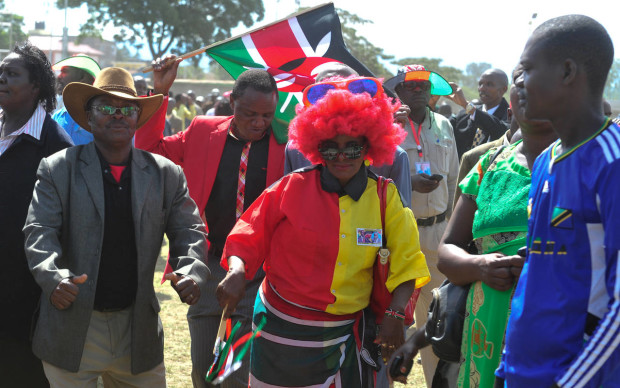 Kenyan people dance in Afraha Stadium, Nakuru, Kenya, as they attend a thanks giving rally, Saturday, April 16, 2016. Kenyan President Uhuru Kenyatta and five others who had been charged with crimes against humanity at the International Criminal Court held a rally attended by thousands to celebrate the withdrawal of the charges against them. The rally has been opposed by opposition leader Raila Odinga and some members of civic organizations who say it does not respect the suffering of the victims of violence following a disputed presidential election late 2007. (AP Photo/Kevin Midigo)
