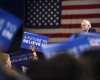 Supporters wave signs as Democratic presidential candidate, Sen. Bernie Sanders, I-Vt., speaks at a campaign rally Monday, April 11, 2016, in Buffalo, N.Y. (AP Photo/Mel Evans)