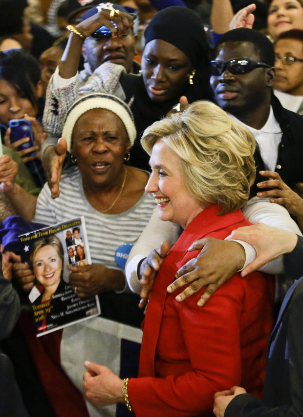 Democratic presidential candidate Hillary Clinton poses for photographs with to supporters Wednesday, April 13, 2016, in New York. (AP Photo/Frank Franklin II)