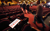 In this April 4, 2016, file photo, supporters of Republican presidential candidate, Donald Trump depart the Milwaukee Theatre after a rally in Milwaukee. When Trump strode onstage for his final rally before the Wisconsin primary, he found an unfamiliar sight: hundreds of empty seats. The election eve rally, which featured the Republican front-runner’s wife’s much-touted return to the campaign trail, was intended as a capstone of Trump’s three-day blitz through the state. A big-enough win the next day could have put Trump on a path to clinch the number of delegates needed to win the nomination ahead of this summer’s Republican National Convention. Instead, the half-empty room was an ominous harbinger of Trump’s fate the next day: he lost to rival Ted Cruz by 13 percentage points. (AP Photo/Charles Rex Arbogast, File)