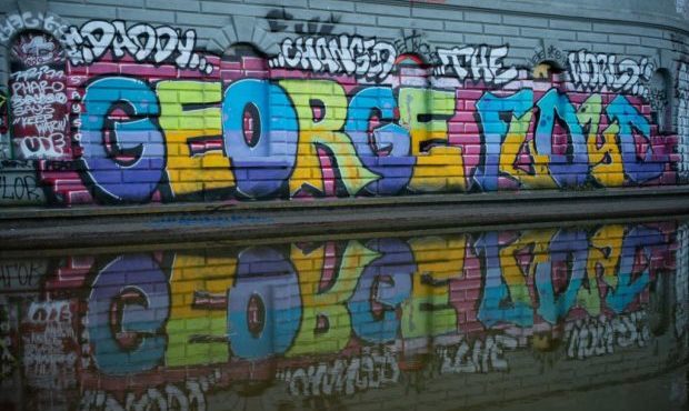 Graffiti bearing the name of George Floyd is seen in Cal Anderson Park in the area known as the Cap...