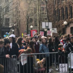 Hundreds of sign-carrying Seattle area students turn out for rally against gun violence in Occidental Park after taking part in the National School Walkout. (Hanna Scott/KIRO Radio)
