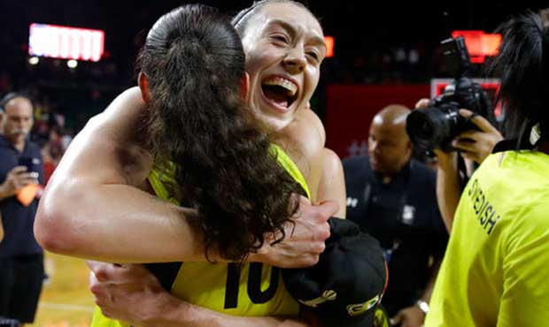 Seattle Storm forward Breanna Stewart (30) hugs teammate Sue Bird (10) on the court after winning G...