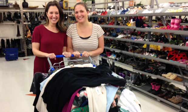 Kelly Herzberg stands with her client, Jamie, at the Shoreline Goodwill. Herzberg helped her find m...